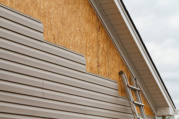 Professional Siding Contractor technician working in Smithville, NJ